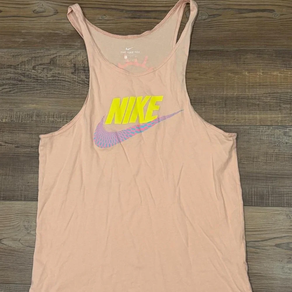 Nike spellout tank top with yellow Nike logo and blue/pink swoosh